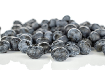 Lot of whole fresh blue blueberry heap isolated on white background
