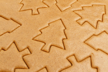 Christmas gingerbread dough cookie background. Christmas trees baking pattern