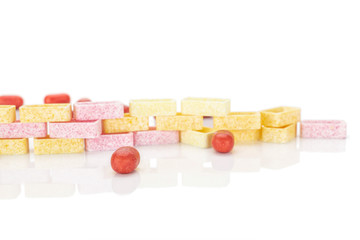 Lot of whole sweet pastel candy wall isolated on white background