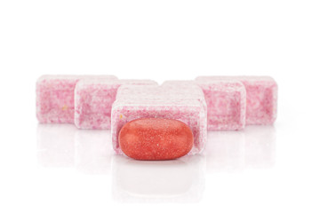 Lot of whole sweet pastel candy front focus isolated on white background