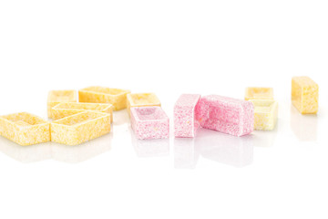 Light lot of whole sweet pastel candy heap isolated on white background