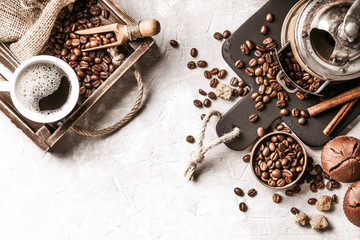 Coffee with  coffee beans on grey textured background. Top view with copy space. Background with free text space.