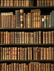 old books on wooden shelf
