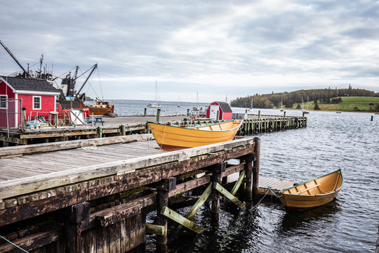Small yellow boat in the harbor in Lunenburg Nova scotia