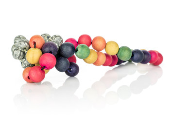Lot of whole colorful wooden bead cluster isolated on white wood