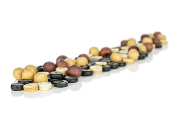 Lot of whole wooden bead in row isolated on white wood
