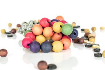 Lot of whole wooden bead heap isolated on white wood