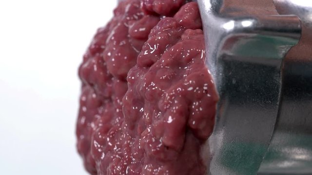 pieces of the liver come out through the holes in the meat grinder when scrolling, it looks very nasty and it looks like the human intestines are scrolling, close-up