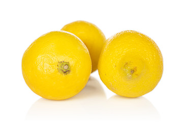 Group of three whole arranged fresh yellow lemon isolated on white background