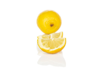 Group of one whole two quarters of fresh yellow lemon isolated on white background