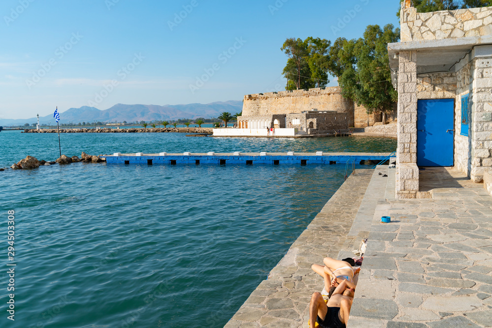 Sticker Rock retaining wall and historic fortification with path around coastline at Nafplio.