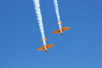 airplane with propeller flying in blue sky 