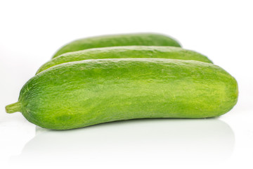 Lot of whole mini green cucumber isolated on white background