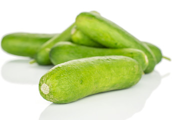 Lot of whole mini green cucumber isolated on white background