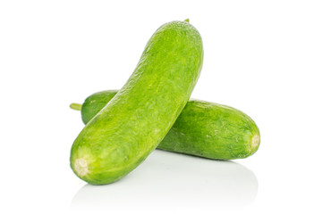 Group of two whole mini green cucumber isolated on white background