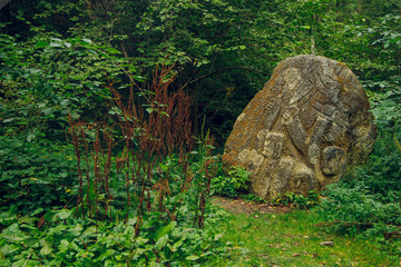 pagan rune stone in fairy tale deep forest Scandinavian peninsula nature environment 