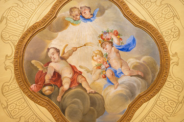 MENAGGIO, ITALY - MAY 8, 2015: The neobaroque  fresco of angels with the holy water in church...