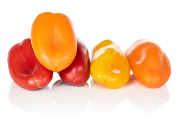 Group of five whole fresh pepper isolated on white background