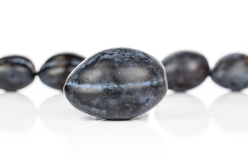 Lot of whole fresh purple plum isolated on white background