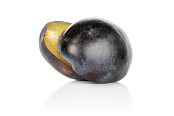 Group of two halves of fresh purple plum isolated on white background