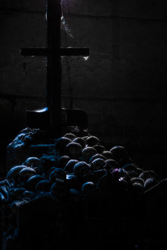 Crucifix and skulls in a crypt in Napoli, Italy