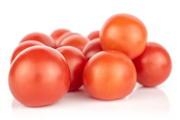 Lot of whole fresh red tomato heap isolated on white background