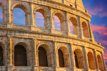 Fototapeta premium Famous Coliseum (Colosseum) of Rome at early sunset