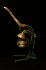 Old manual metal orange squeezer