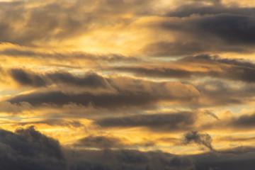 Colorful dramatic sky with clouds during sunset or sunrise