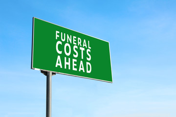 Advertising billboard with text FUNERAL COSTS AHEAD outdoors