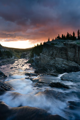 Swiftcurrent Lake river flowing towards the sunrise at East Glacier, Montana.