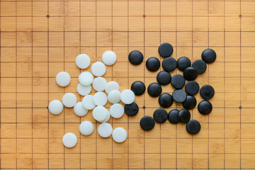 top view black and white go on a board horizontal composition