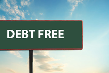 Billboard with text DEBT FREE against blue sky