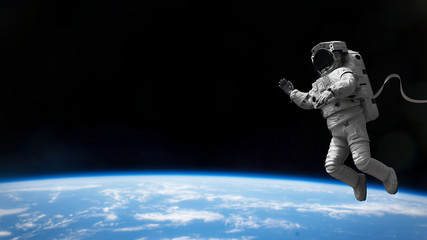 astronaut during spacewalk in empty space  © dottedyeti