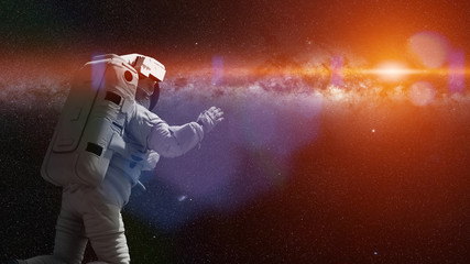 astronaut in outer space flying towards the stars © dottedyeti