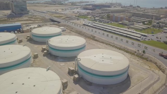 Very large storage tank silos with pipes (4K)