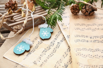 Christmas composition with music notes on table