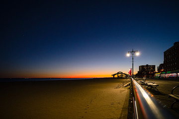 Brooklyn, New York - Octouber 4, 2019: Brighton Beach, Coney Island boardwalk in Brooklyn, New York at sunset.