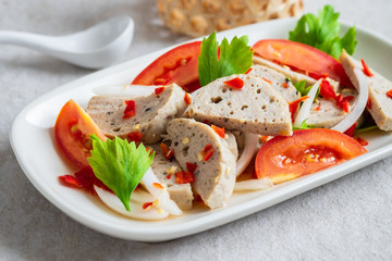 Spicy vietnamese pork sausage salad (Yum Moo Yor).
