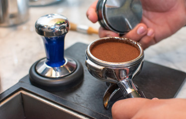 coffee portafilter with coffee inside