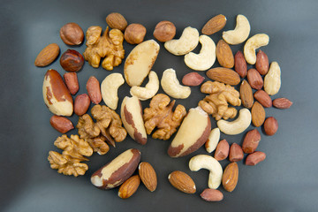 Fototapeta na wymiar different nuts on a plate