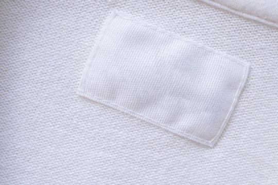 Blank White Clothes Label On New Shirt Background