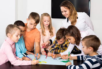 Team of elementary age children  drawing