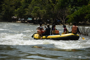 Group rowing on river