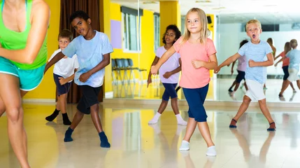 Deurstickers Active young children posing at dance class © JackF