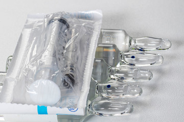 Ampoule and syringe.