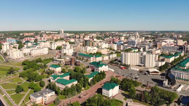 Aerial flight forward to the city center of Saransk, Russia. Administrative and cultural buildings, streets and squares in the shot. Taken by drone