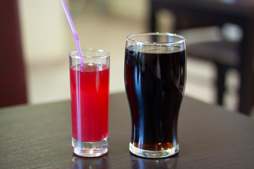 Two glasses of beverage on a table