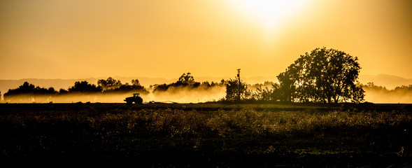 Obraz na płótnie Canvas American Ranch Backlit at sunset 