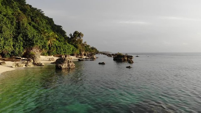aerial view of a tropical island with clear water palm trees and coral reef in Vanuatu, South pacific